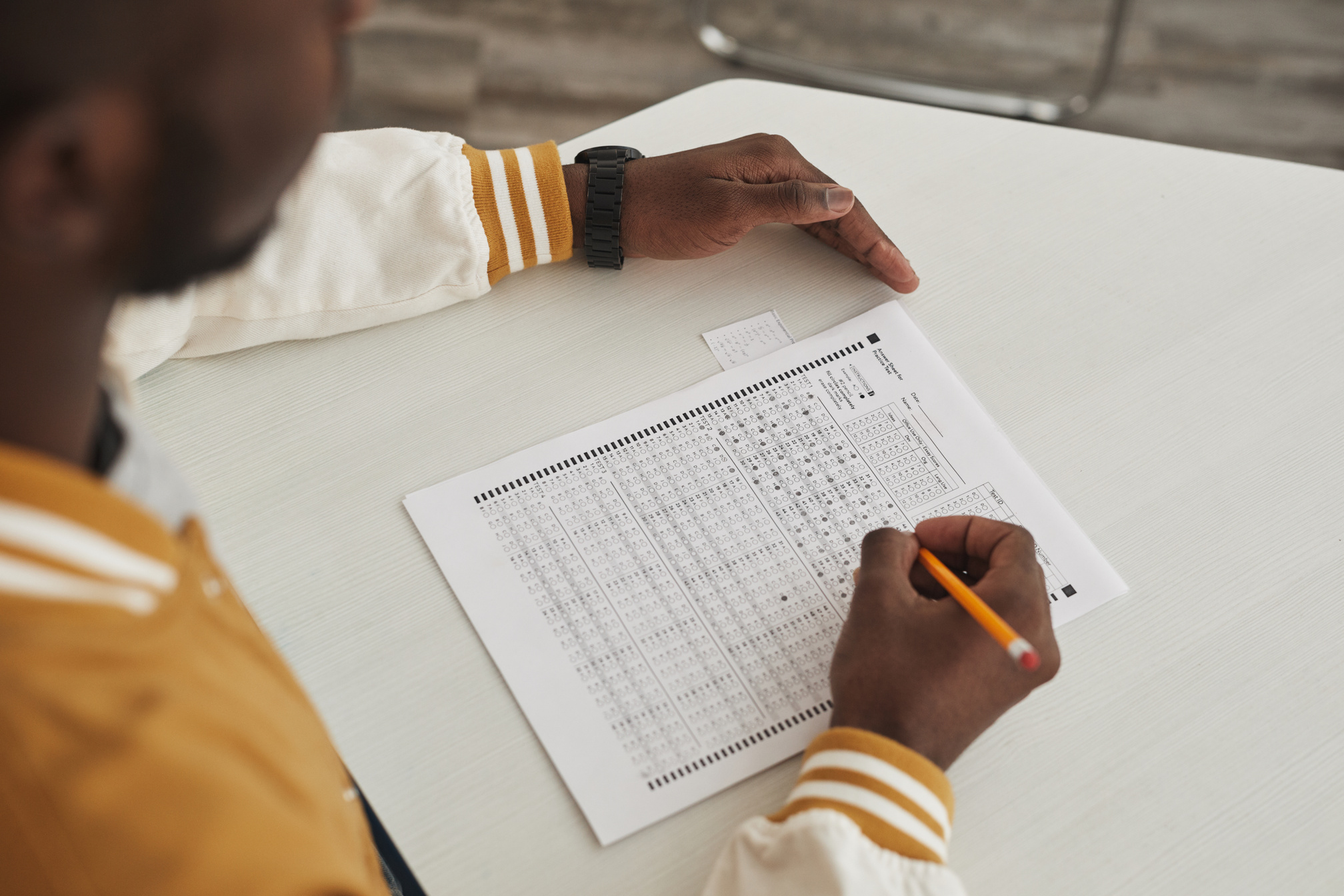 A Person Cheating in an Exam